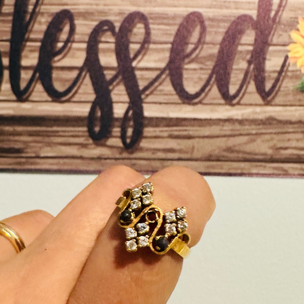 Elegant Gold and Black Women's Ring missing one stone